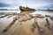 sunken shipwreck visible at low tide