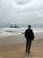 Sunken trawler, shipwreck. Ship Zeila at Skeleton Coast Namibia. Man stands.