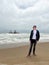 Sunken trawler, shipwreck. Ship Zeila at Skeleton Coast Namibia. Man stands.