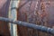 Sunlight across large and small pipes, rust and peeling paint textures