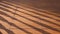 Sunlight and Baluster Shadow on Surface of Brown wooden tile floor on vintage style