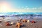 Sunlight, blue water, colorful starfish and shells on the beach summer holiday background