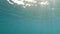 Sunlight falling under the water. landscapes underwater waves on the water surface. Underwater scenario of the water