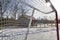 Sunlight on the hockey goal nets  in the rural park in winter