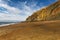 Sunlight lights the copper cliffs at Whale Chine in The isle of wight, England