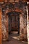 SUNLIGHT ON LINED UP OPEN DOORWAYS INSIDE INNER STRUCTURE OF FORT IN RUINS