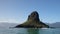 Sunlight on Mokolii island [also known as Chinamans Hat] as seen from the water on the North Shore of Oahu Hawaii United States