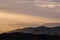 Sunlight on mountain landscape and misty