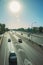 Sunlight over cars on a highway with traffic in Madrid