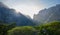 Sunlight popping over mountains at sunrise in nature in Camps Bay.