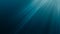 Sunlight rays shining through ocean surface. View from underwater. 3D rendered seamless loop animation