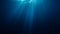 Sunlight rays shining through ocean surface. View from underwater. 3D rendered seamless loop animation
