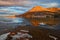 Sunlight on the Red Butte with lake in the foreground