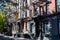 Sunlight shines on a block of historic buildings on Leroy Street in the West Village neighborhood of New York City