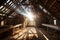 sunlight shining through gaps in the restored barn roof