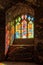 Sunlight streaming through a stained glass window, Goodrich Castle, Herefordshire.