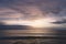 Sunlight sunset on horizon ocean on background seascape atmosphere rays sunrise. Relax view waves sea on evening sand beach, sun