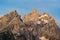 Sunlight Warms The Top of Grand Teton and The Remaining Snow In Summer