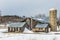 Sunlit Barns and Silos in Winter