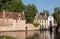 Sunlit Beguinage wall and entrance, Bruges, Belgium