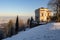 a sunlit belvedere atop an italianate villa in a snowy landscape