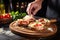 sunlit bruschetta with garlic and grated cheese, round wooden plate