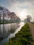 Sunlit Canal Path at Dawn