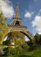 Sunlit Eiffel Tower, Paris, over park and lake