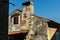 The Sunlit Facade: Croatian Old House with Colorful Shutters and Contrasting Shadows