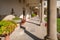 Sunlit hallway in cortyard of Madonna del Sasso monastery in Italy