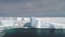 Sunlit icebergs in Antarctica ocean. Aerial shot.