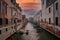 Sunlit Narrow Canal in Venice, Italy: Serene and Tranquil Waterway in Unknown Location