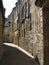 Sunlit narrow street in Sarlat, Dordogne