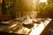 sunlit patio table with folded napkins and wine glasses