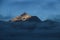 Sunlit peak of Mount Oldehore in early morning