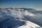 Sunlit ridges of Velka Fatra and Nizke Tatry above the clouds