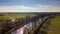 Sunlit River Meandering Through Countryside