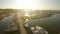 Sunlit sailing boats and yachts docked at marina, mediterranean tourist city