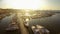 Sunlit sailing boats and yachts docked at marina, mediterranean tourist city