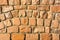 Sunlit sandstone brick wall as a background