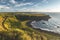 Sunlit shoreline. Northern Ireland landscape.