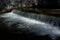 Sunlit Waterfall With Fresh Water Of An Alpine River