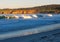 Sunlit waves and cliffs