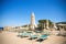 Sunloungers and umbrellas in Baja Sardinia, Italy