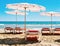 Sunloungers and umbrellas in a quiet beach