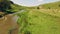 Sunning view alongside a slow river in green grass