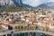 Sunny aerial cityscape of Lecco town on spring day. Picturesque waterfront of Lecco town located between famous Lake Como and