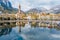 Sunny aerial cityscape of Lecco town on spring day. Picturesque waterfront of Lecco town located between famous Lake Como and