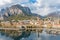 Sunny aerial cityscape of Lecco town on spring day. Picturesque waterfront of Lecco town located between famous Lake Como and