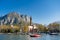 Sunny aerial cityscape of Lecco town on spring morning. Picturesque waterfront of Lecco town located between famous Lake Como and